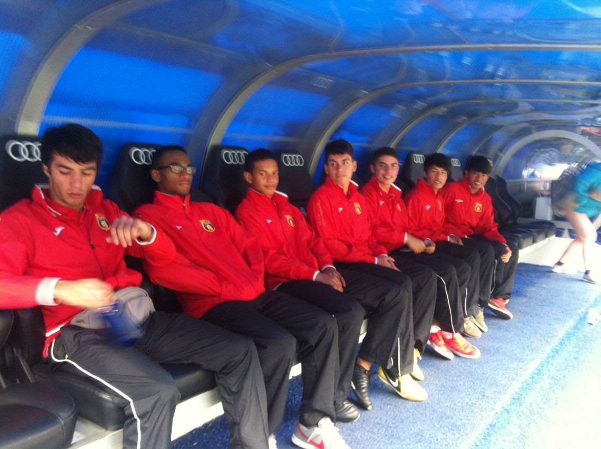 Players in the dugout in Lisbon
